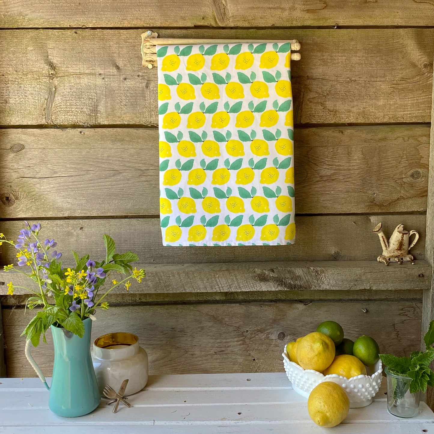 Lemon themed cotton tea towel with watercolor lemons, ethically made in USA