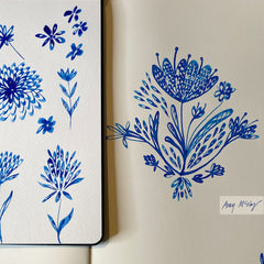 sketchbook drawings of decorative flowers in indigo ink by Amy McCoy