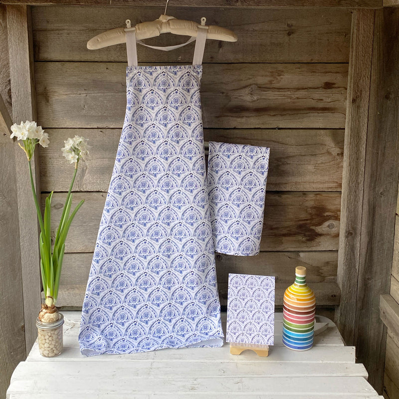 100% cotton apron in an indigo watercolor pattern inspired by Mediterranean tiles